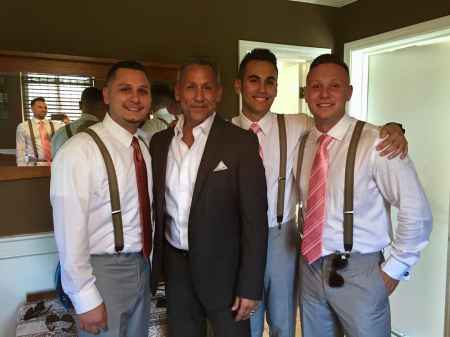 Angelo Pagan along with his three sons